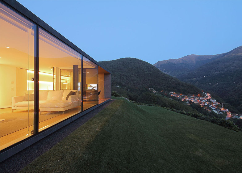 “Like a stone in the landscape”… Angular home in the Swiss Alps